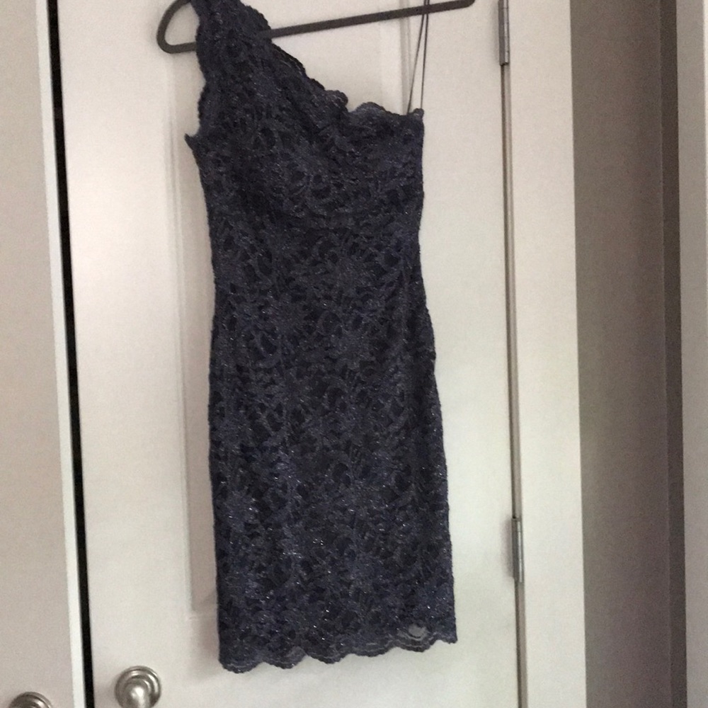 Lace one- shoulder cocktail dress.
